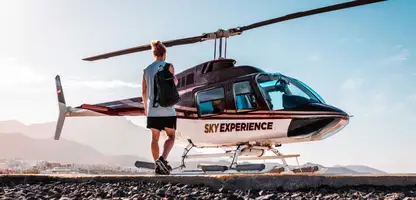 Young woman walking towards an helicopter